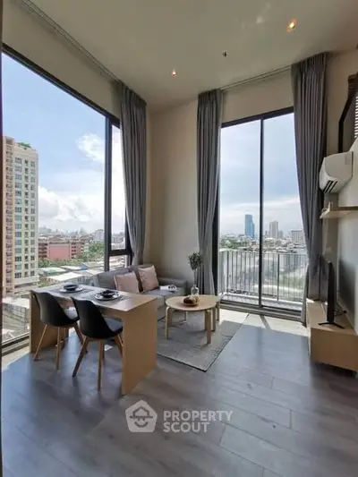 Modern living room with floor-to-ceiling windows and stunning city view