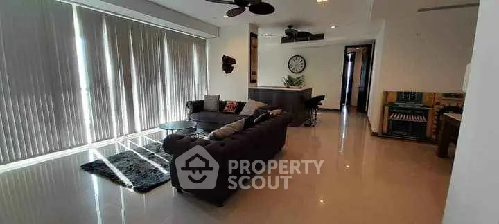 Spacious modern living room with sleek design and abundant natural light