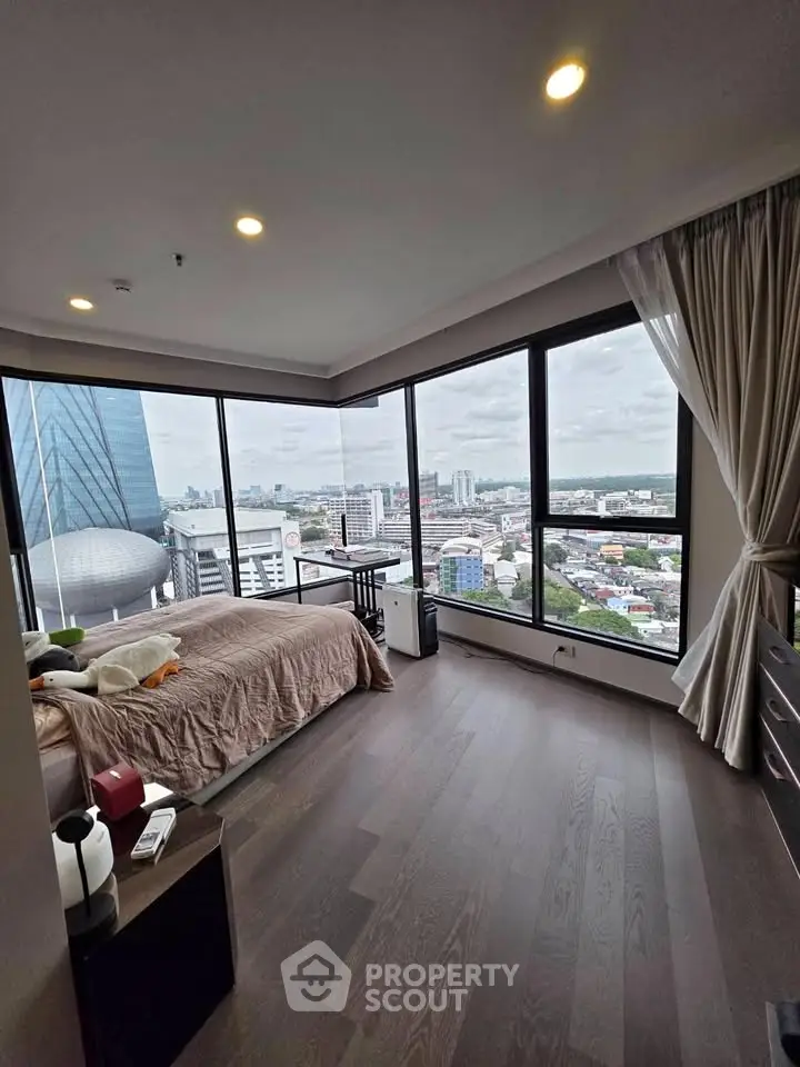 Luxurious corner bedroom with panoramic city views and modern decor