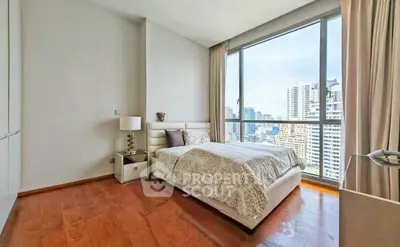 Luxurious bedroom with stunning city view and elegant decor