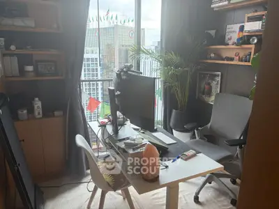 Modern home office with large window view, ergonomic chair, and stylish decor.