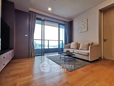 Spacious living room with modern decor and balcony view