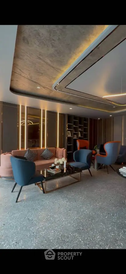 Luxurious modern living room with stylish furniture and ambient lighting, perfect for relaxation and entertainment.