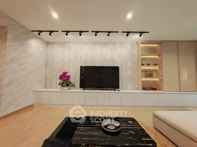 Modern living room with sleek TV setup and elegant decor