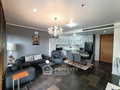 Spacious open-plan living room with modern kitchen and elegant decor