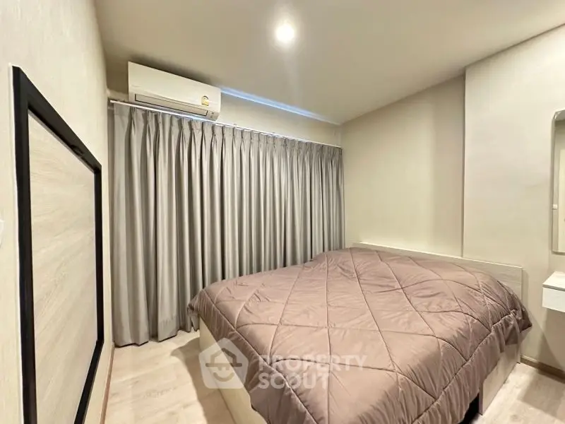 Cozy bedroom with modern decor and air conditioning