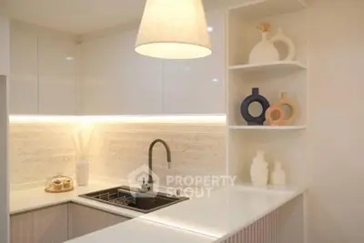 Modern kitchen with sleek white cabinets and stylish open shelving