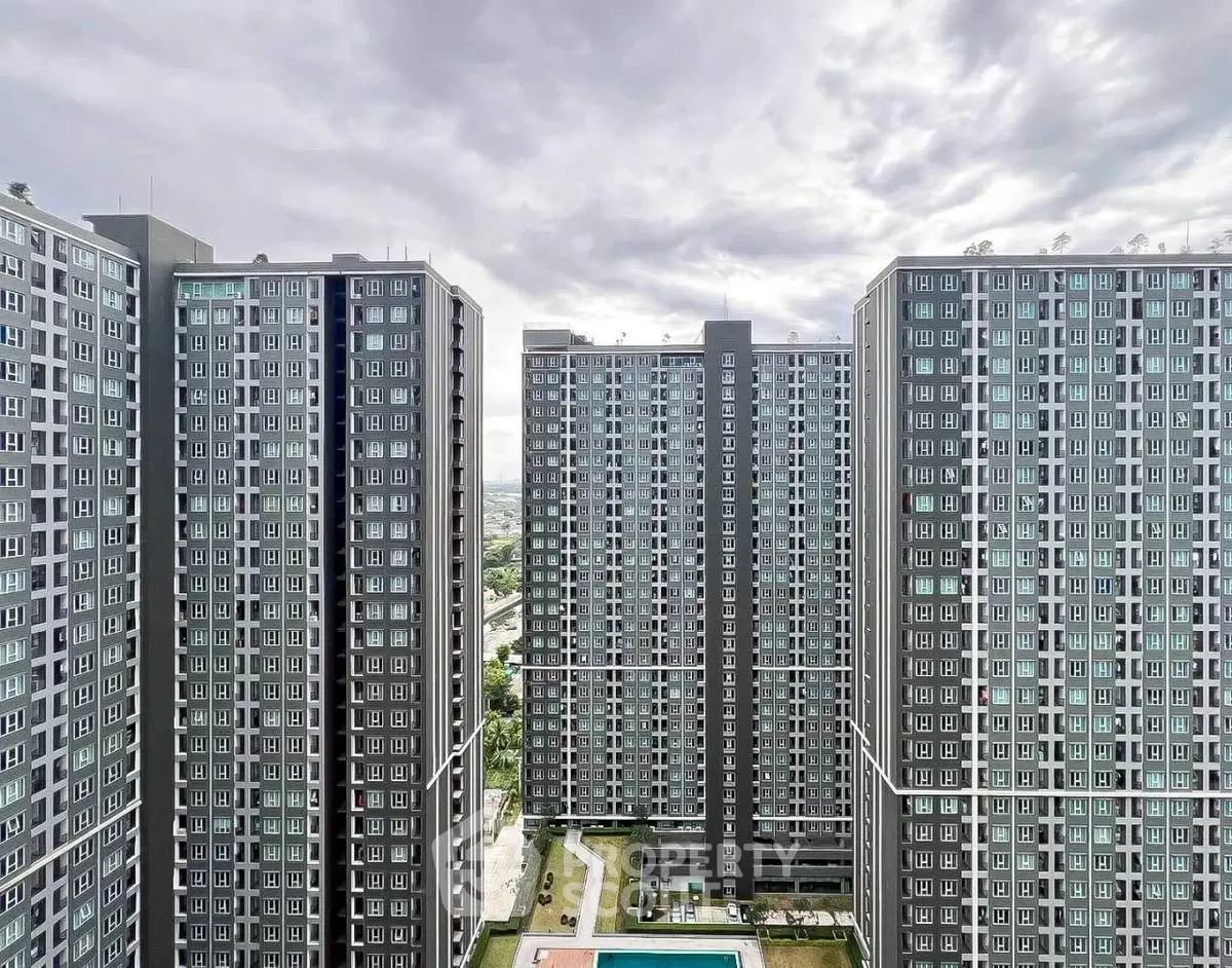 Stunning high-rise apartment complex with modern architecture and panoramic city views.