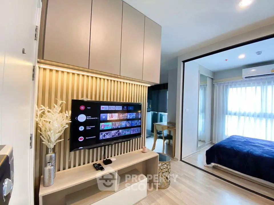Modern living room with TV and stylish decor in a cozy apartment
