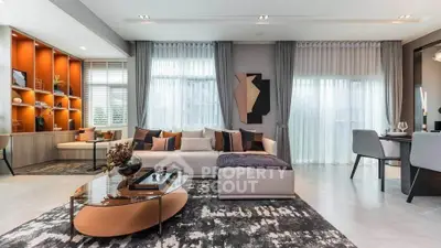 Luxurious modern living room with stylish decor and large windows offering abundant natural light.