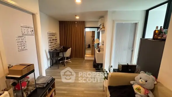 Charming apartment interior with cozy living area and study nook, perfect for modern living.