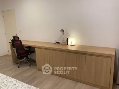 Modern study room with sleek wooden desk and ergonomic chair