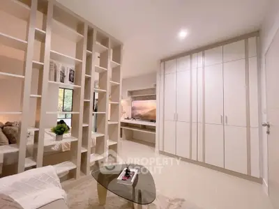 Modern living room with stylish shelving and sleek storage cabinets