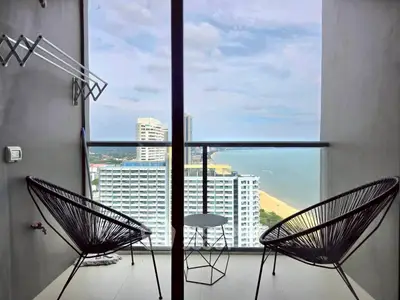 Stunning balcony with ocean view in modern high-rise apartment