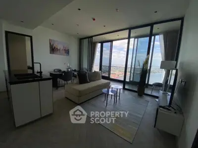Modern living room with stunning city view and open layout, featuring sleek furniture and floor-to-ceiling windows.