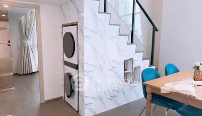 Modern duplex interior with stylish staircase and dining area