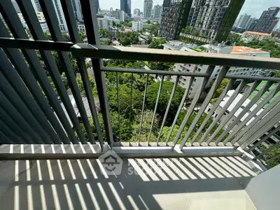 Modern balcony with cityscape view and sleek railing design
