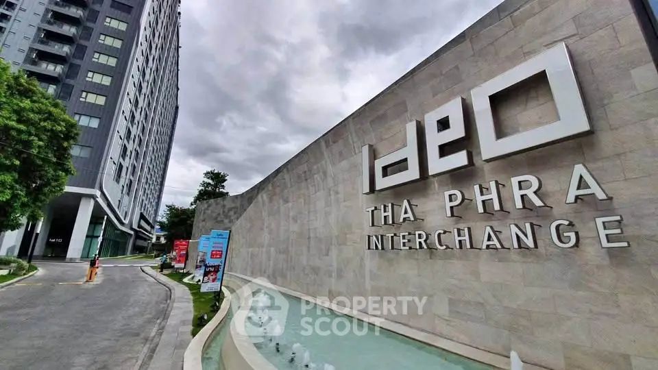 Modern high-rise building exterior with sleek design at Ideo Tha Phra Interchange.