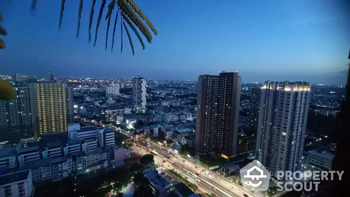 Stunning cityscape view from high-rise balcony at dusk, showcasing vibrant urban skyline.