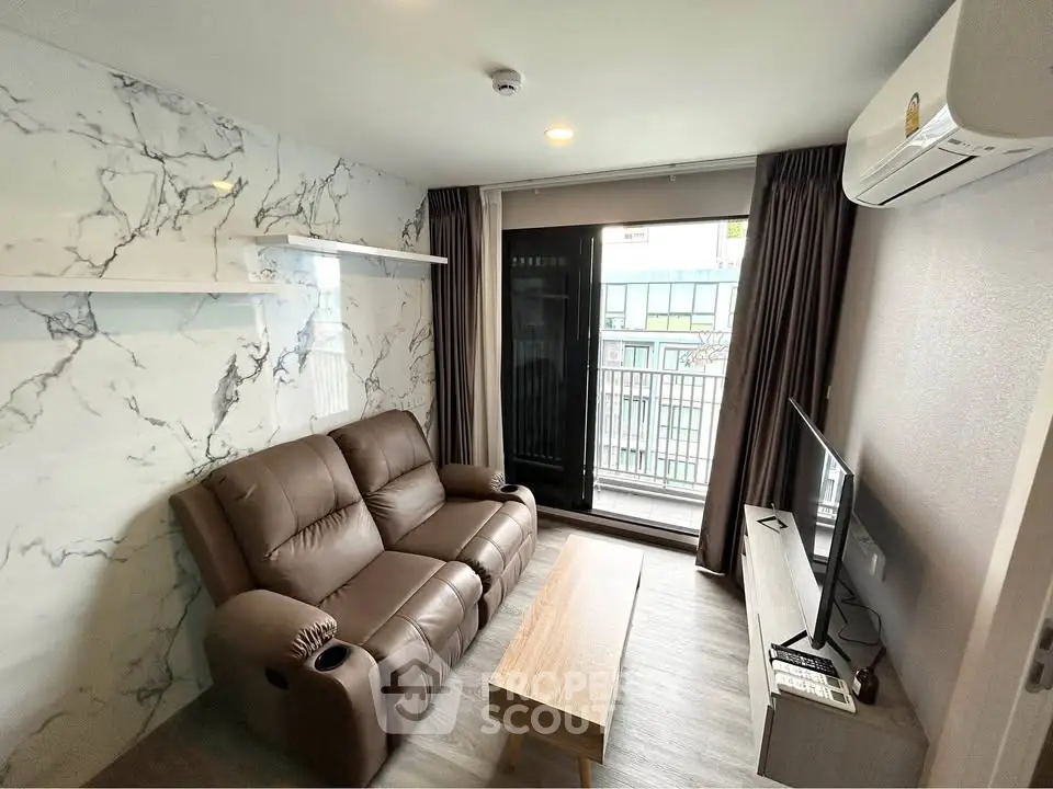 Modern living room with leather sofa, marble accent wall, and balcony view