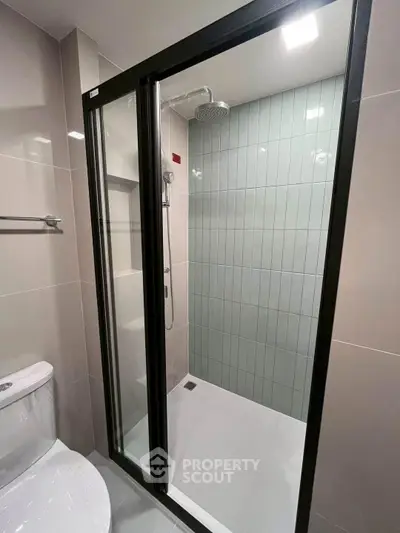 Modern bathroom with sleek shower enclosure and contemporary fixtures