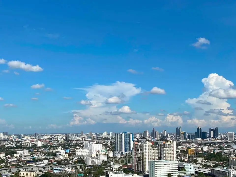 Stunning cityscape view with clear blue skies and modern skyline, perfect for urban living enthusiasts.