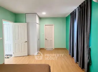 Spacious bedroom with modern design and ample natural light