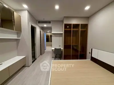 Modern bedroom with sleek design and built-in storage solutions