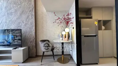 Modern living room with stylish decor and sleek refrigerator