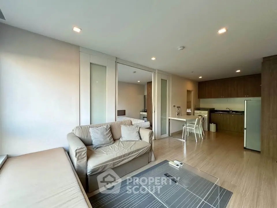 Spacious modern living room with open kitchen and cozy seating area