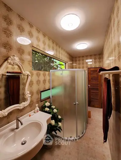 Charming vintage bathroom with elegant fixtures and natural light.