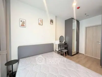Modern bedroom with stylish decor and ample natural light