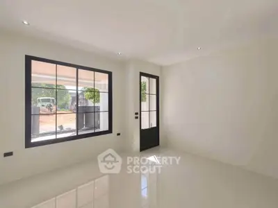 Bright empty room with large window and door, ideal for customization