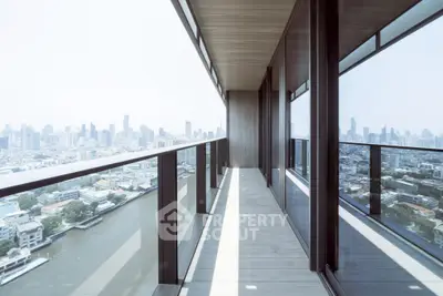 Stunning high-rise balcony with panoramic city and river views, perfect for urban living.