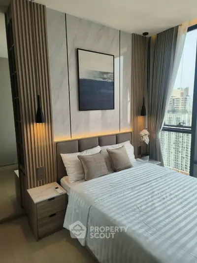 Luxurious modern bedroom with city view, elegant decor, and natural light