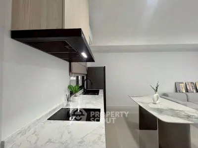 Modern kitchen with sleek marble countertops and open layout design