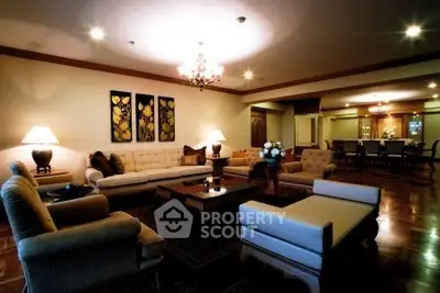 Luxurious living room with elegant furniture and ambient lighting in a spacious open layout.