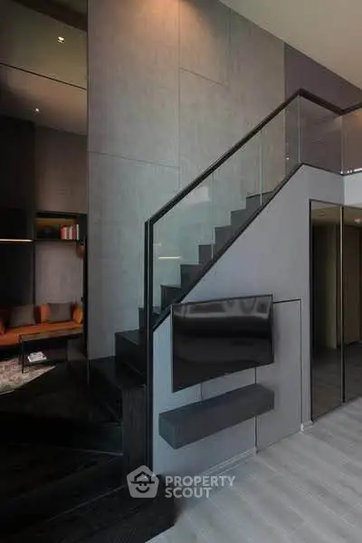 Modern interior with sleek staircase and cozy living area