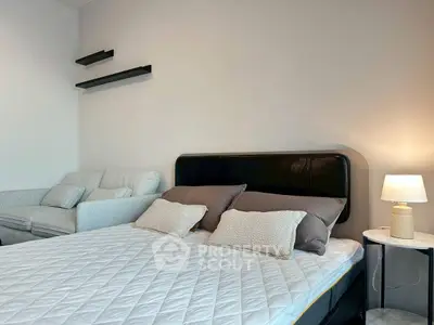 Cozy bedroom with modern decor and comfortable bedding