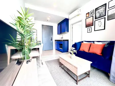 Modern living room with vibrant blue accents and stylish decor