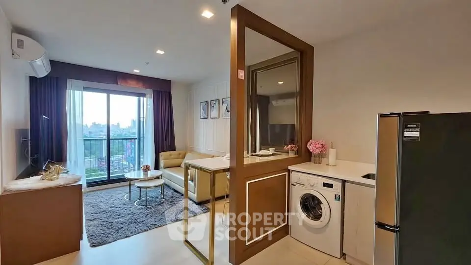 Modern living room with washing machine and balcony view in stylish apartment