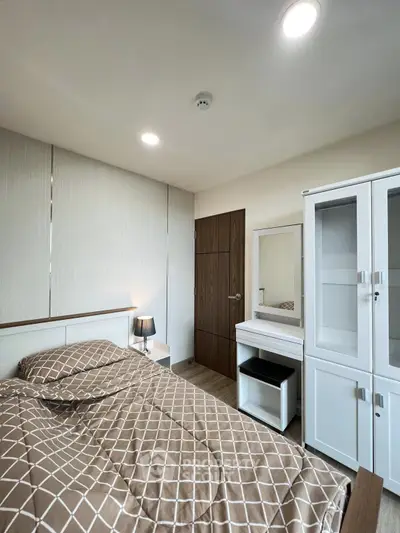 Modern bedroom with stylish furniture and cozy lighting