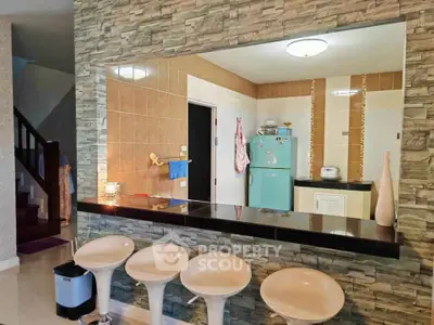Stylish kitchen with open layout and modern bar seating