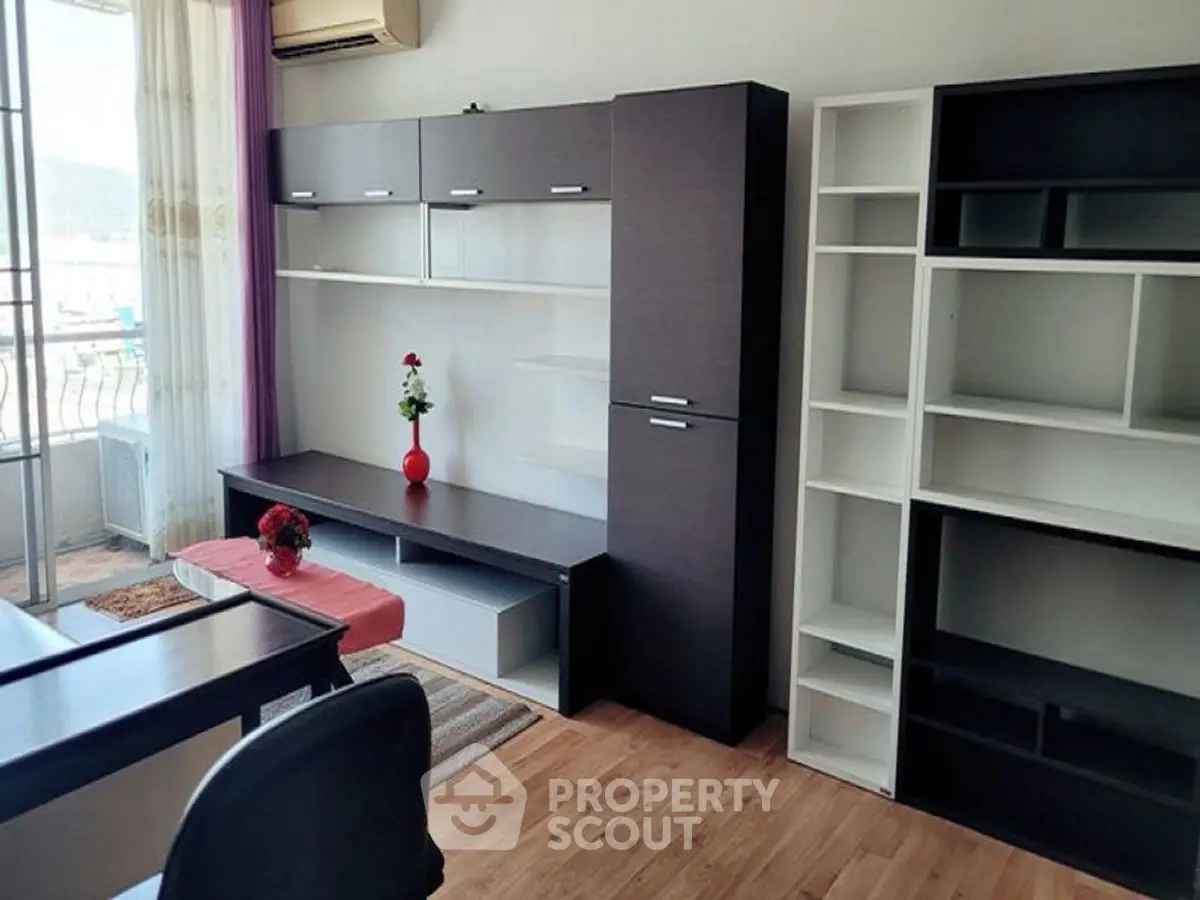 Modern living room with stylish shelving and balcony view