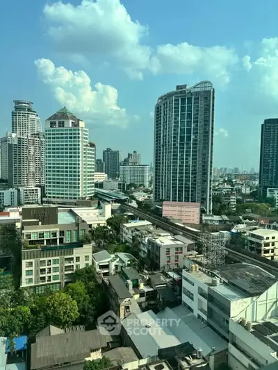 Stunning cityscape view showcasing modern high-rise buildings under a clear blue sky.