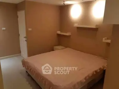 Cozy bedroom with soft lighting and minimalist decor, perfect for relaxation.