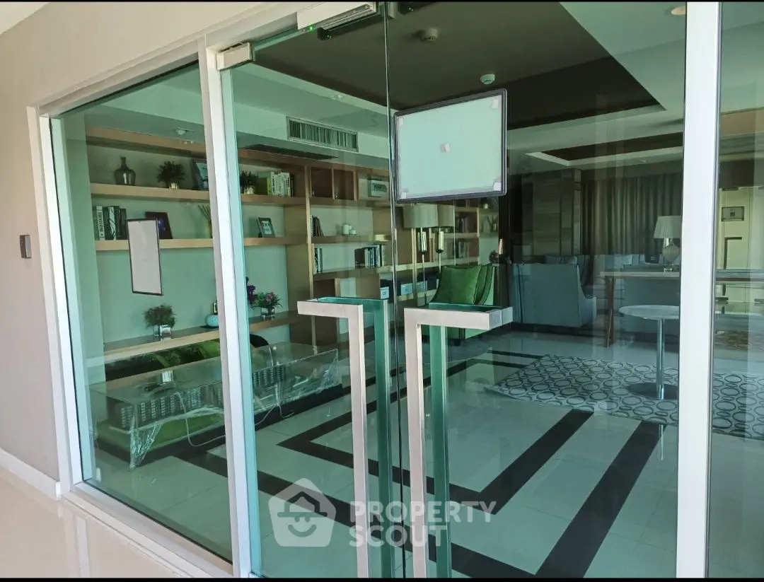Modern living room with glass doors and stylish decor