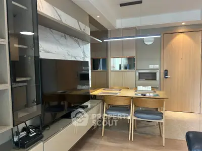 Modern living room with sleek furniture and stylish dining area in open layout apartment.
