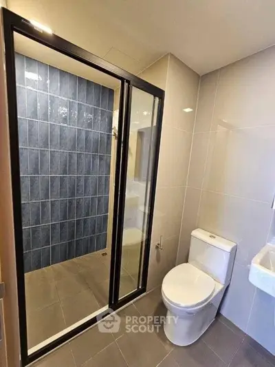 Modern bathroom with sleek shower and elegant tile design