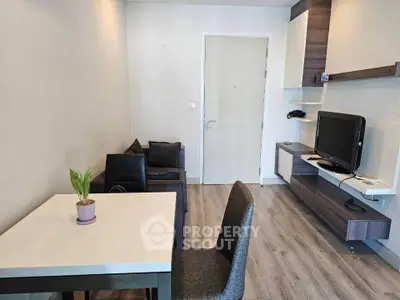 Modern living room with sleek furniture and stylish decor, perfect for urban living.